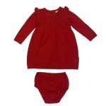 Red long sleeve pleated dress with diamond shape designs and a red pant