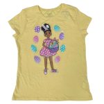 Yellow short sleeve top with a girl holding a basket with rabbit in it and egg designs