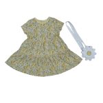 Shade of yellow short sleeve dress with flower designs and white cross bag