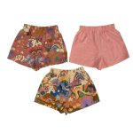 Multicolor short with animal, rainbow and text designs and a plain short